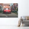 Grey sofa with pillows near white wall in stylish living room in Photographie Porsche GT4 and tags