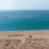 Photographie plage Zahara de los Atunes Vue d’en haut de la plage de Zahara de los Atunes en Espagne, océan turquoise, sable doré et dunes