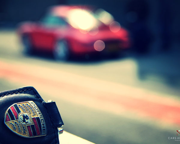 Porsche Key and 911 Carrera in Background